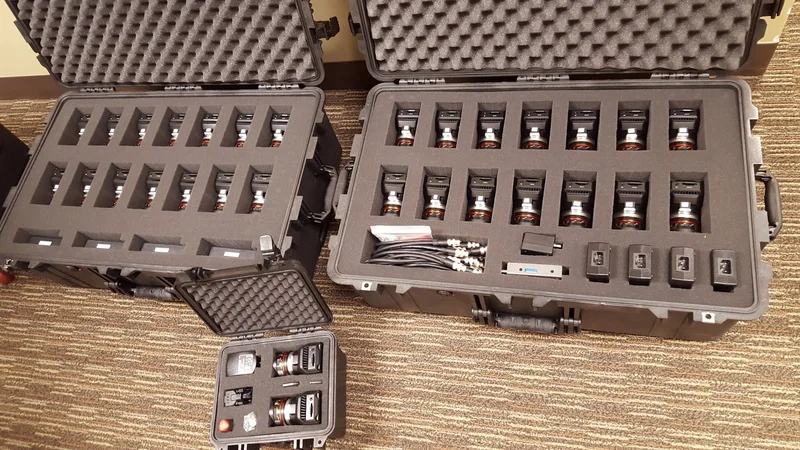 Individual camera modules packed into transport cases.