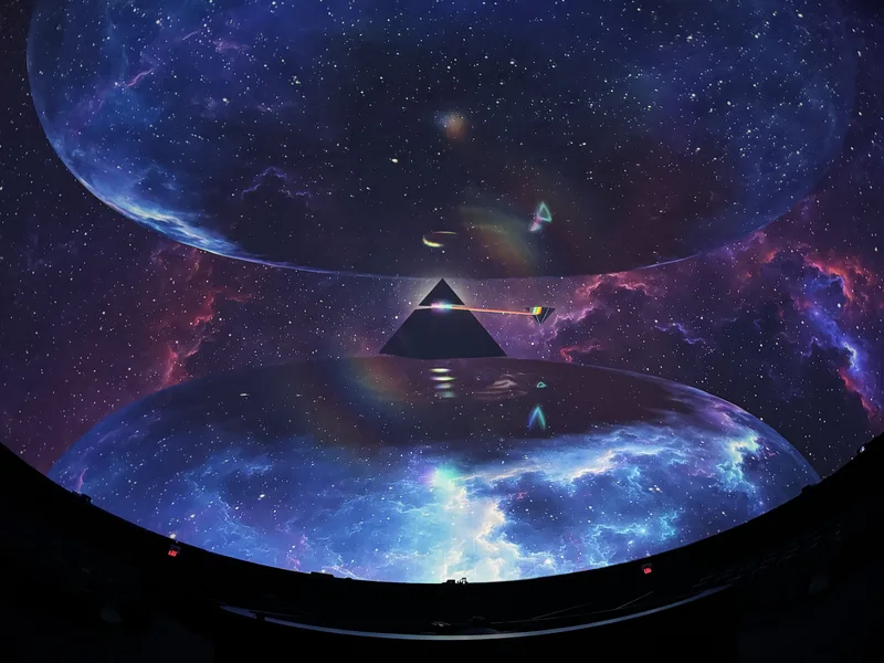 Dome theatre displaying colorful Pink Floyd projected art.