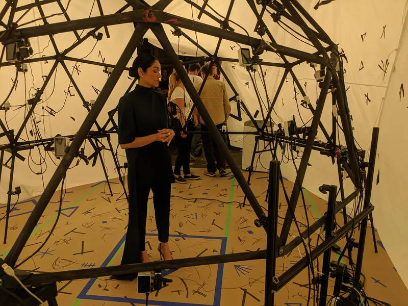 Performer standing inside the studio’s portable capture dome.