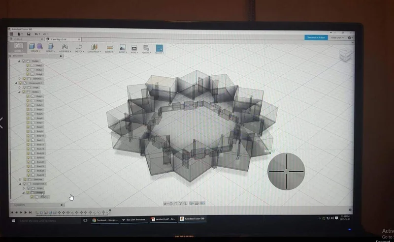 Computer display showing CAD/layout model of circular stereo camera geometry.