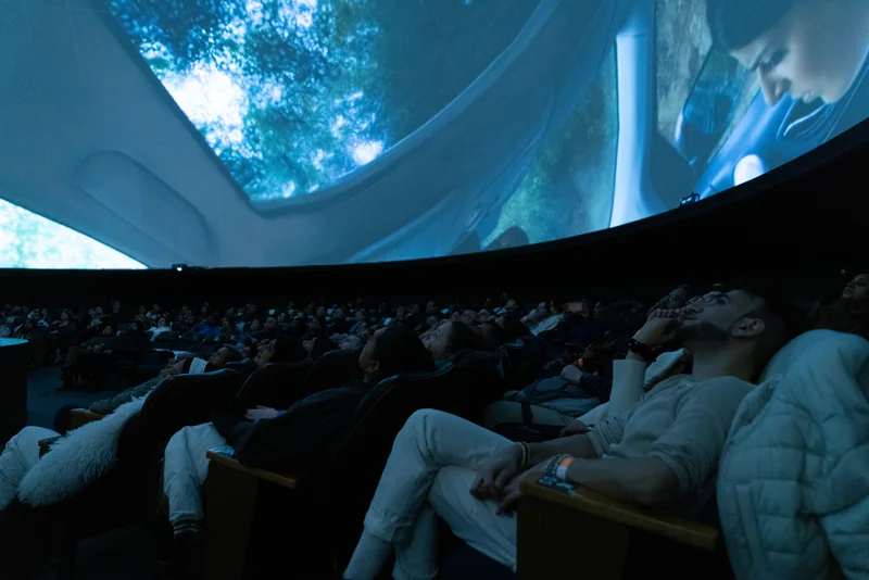 Full Dome theatre with audience and movie projection.