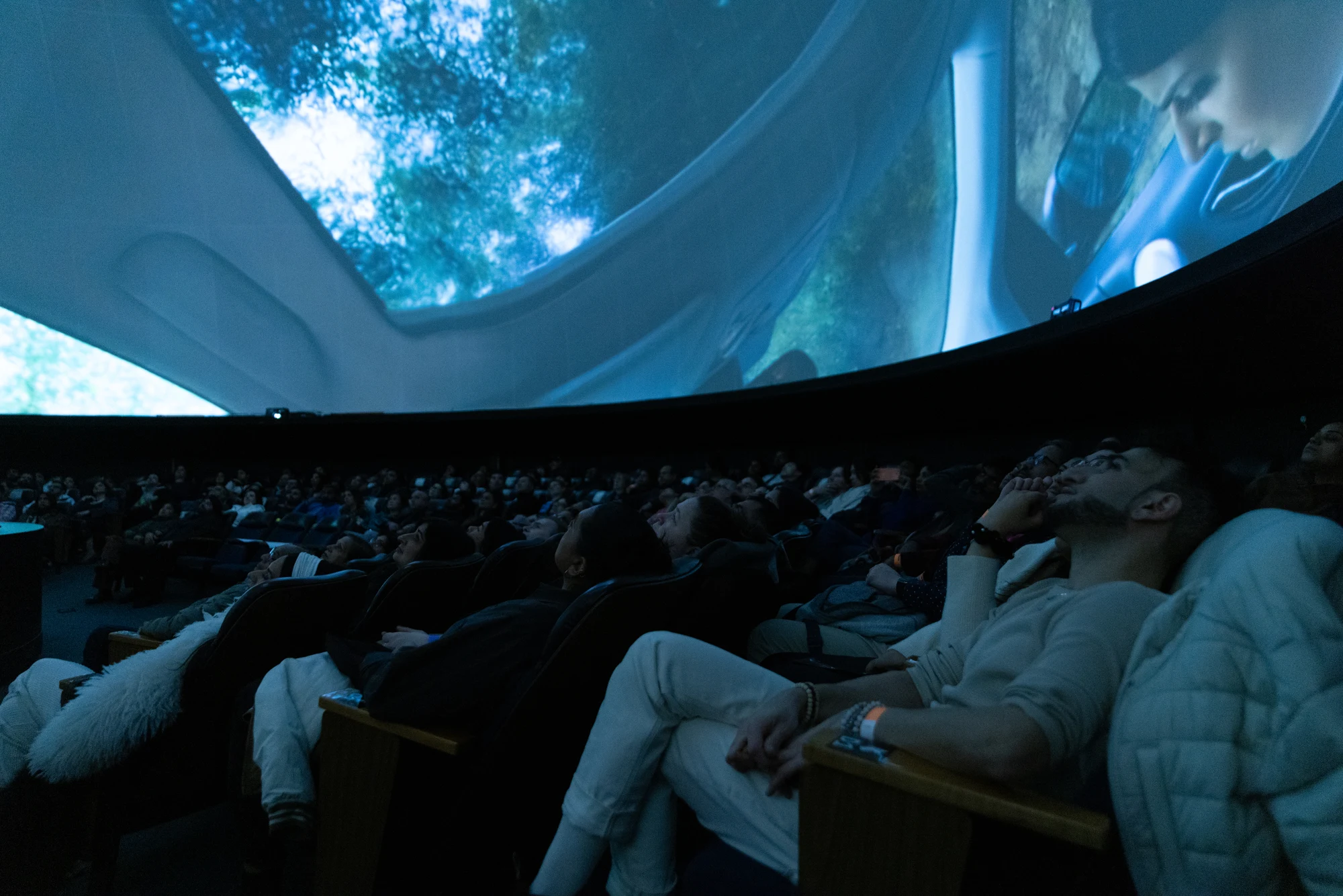Full Dome theatre with audience and movie projection.