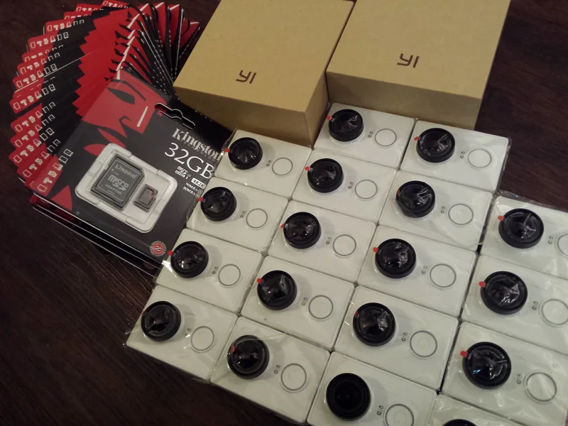 Collection of Yi camera units and storage media assembled for prototype development.