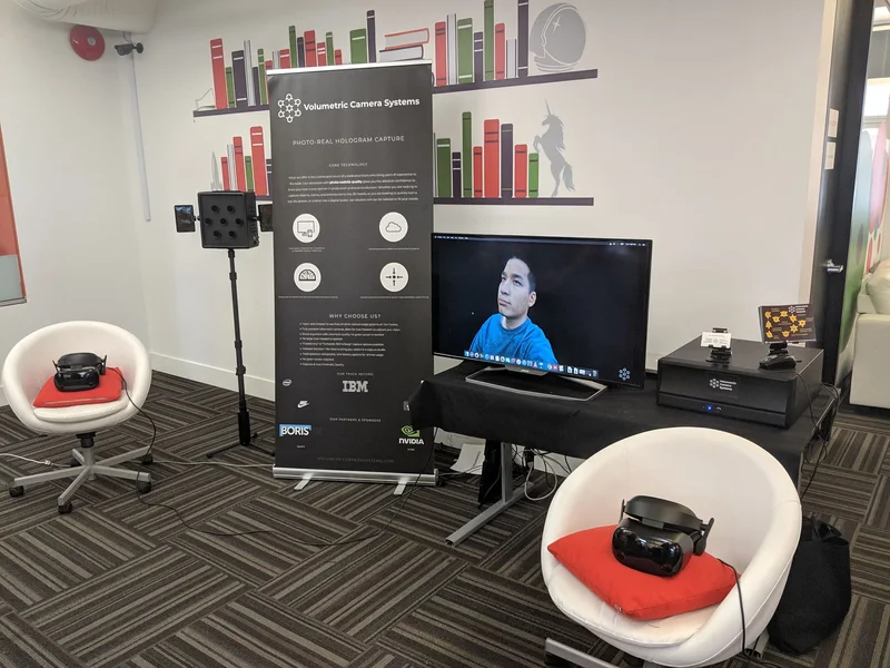 VCS camera, headset chairs, banner and display in the TED 2019 demonstration area.