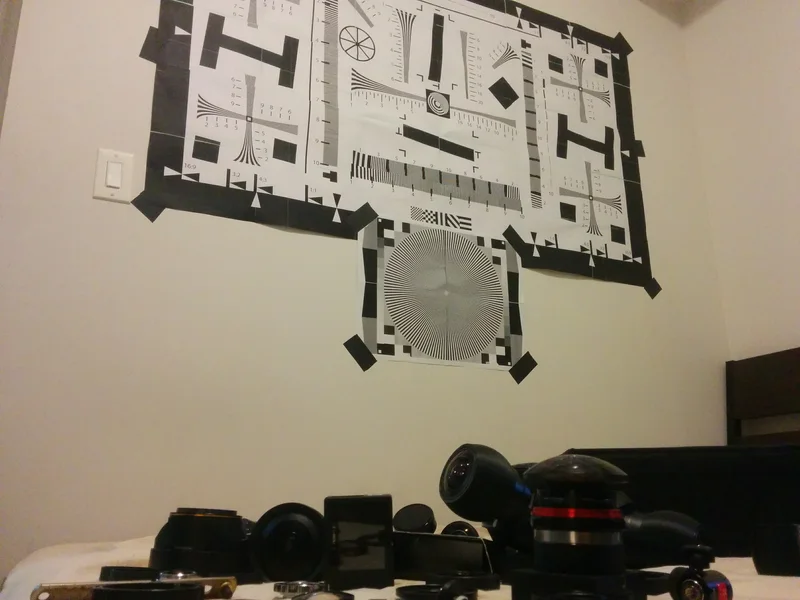 Camera/lens prototypes positioned beneath calibration targets.