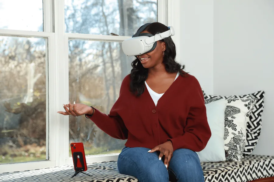 A participant uses Kokomo with a VR headset and smartphone.