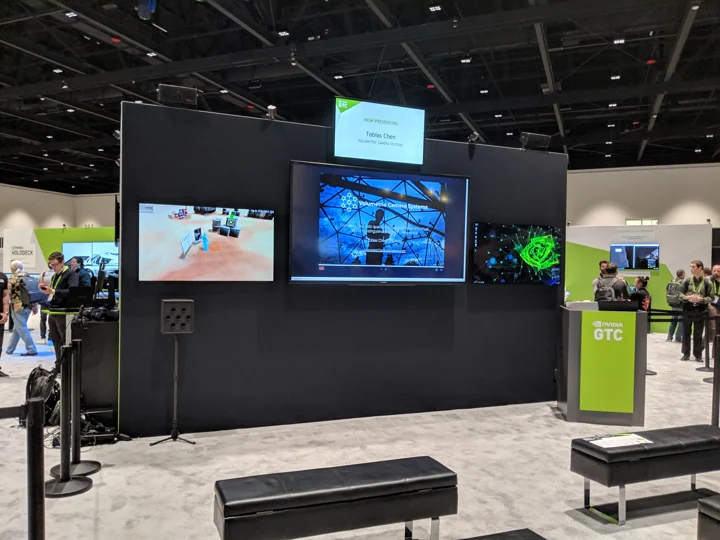 VR demonstration displays and attendees in the GTC exhibition hall, San Jose.