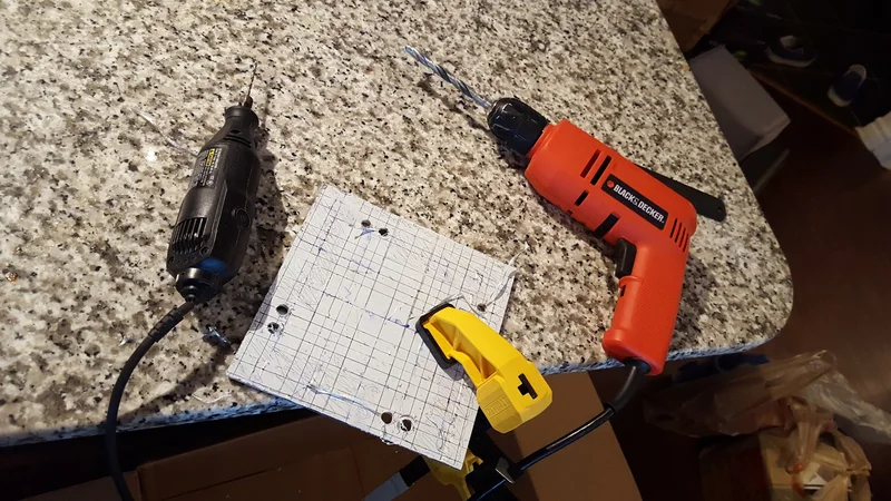 Scrap-material camera-build workbench and assembly tools.