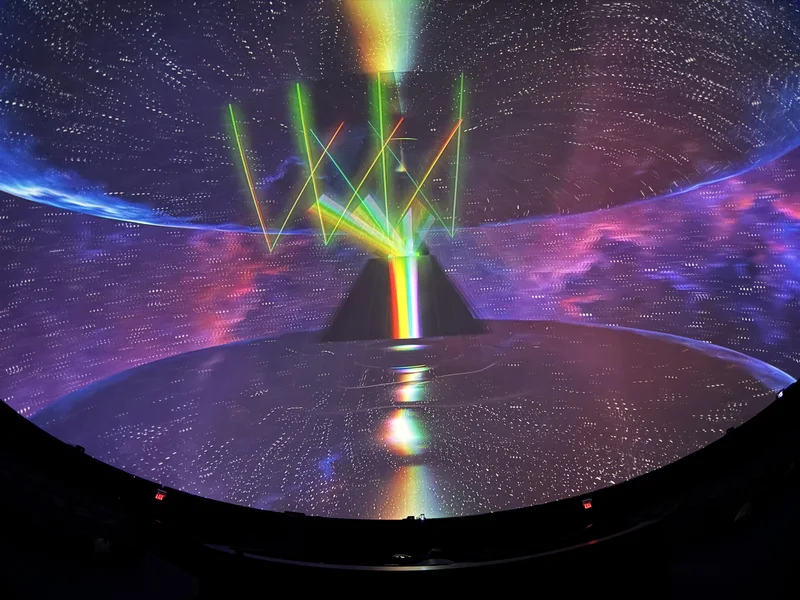 Dome theatre displaying colorful Pink Floyd projected art.